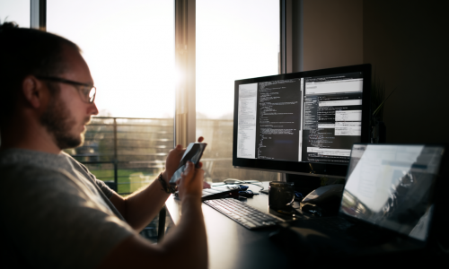 u8387558116_photo_of_happy_developer_working_at_home_white_li_93bedcc5-90ce-417d-bd04-2633690d7d1a_0