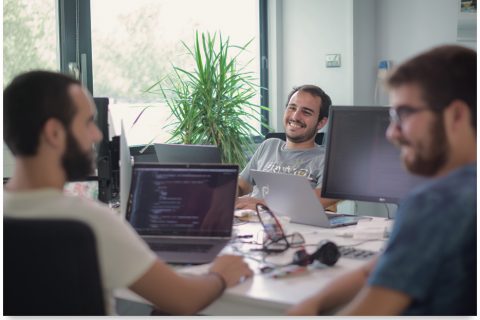 u8387558116_photo_at_office_3_spanish_developers_casually_wor_264c116b-81b5-41ba-a50d-33948ee36a43_0 1